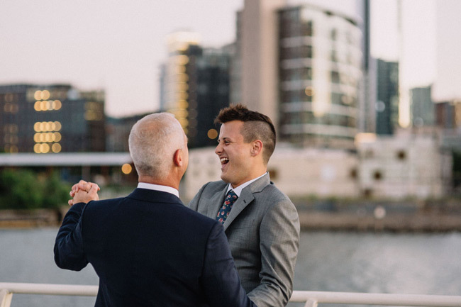 Questions To Ask Your Yacht Wedding Venue | Two grooms first dance on deck Questions To Ask Your Yacht Wedding Venue | Two grooms first dance on deck